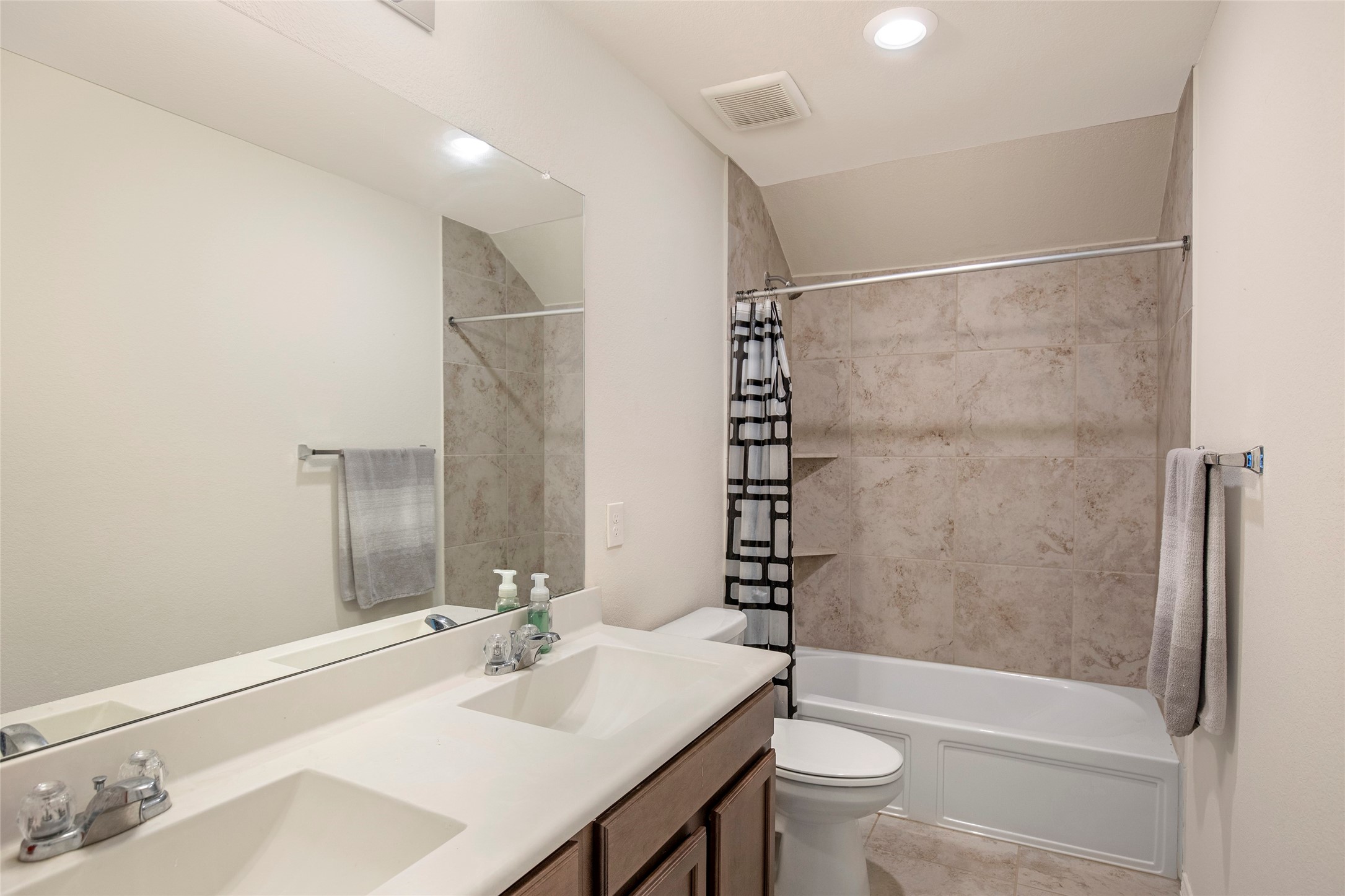 4519 Whitehaven Ridge Way Porter, TX 77365 - Photo 33 of 35 a bathroom with a sink a toilet and shower