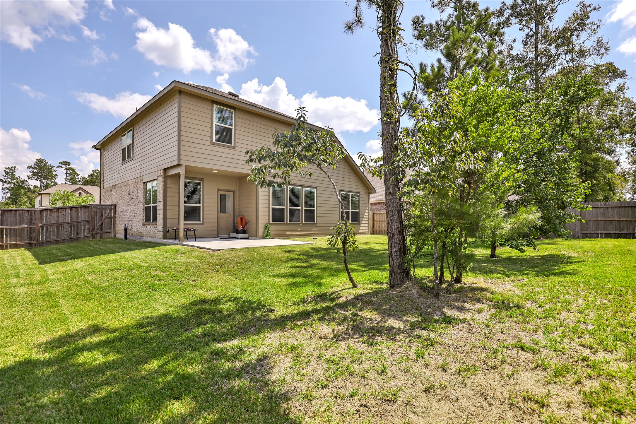 4519 Whitehaven Ridge Way Porter, TX 77365 - Photo 7 of 35 a view of a house with a yard