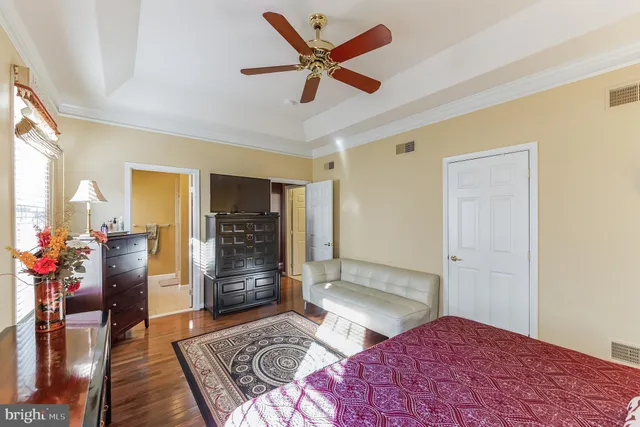 a bedroom with a bed and a walk in closet