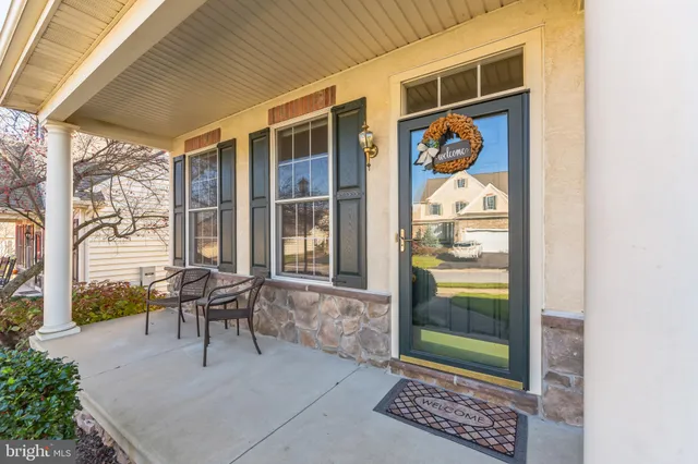 a view of a patio with table and chairs and potted plants