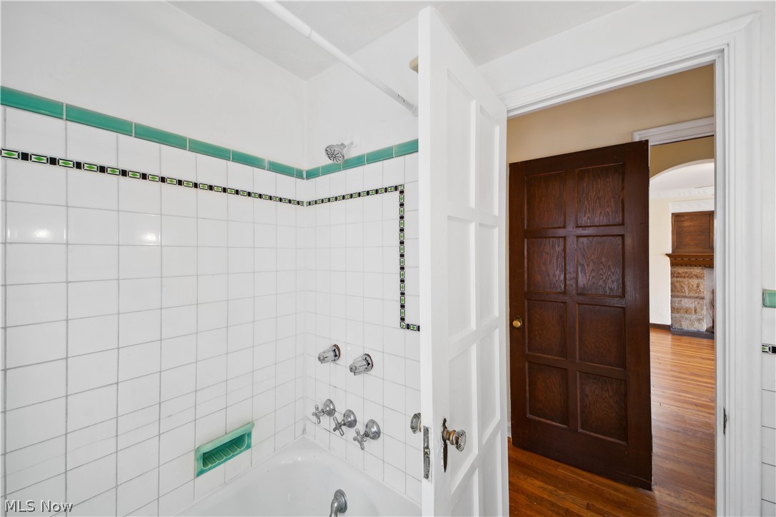 3666 Winchell Road Beachwood, OH 44122 - Photo 25 of 46 Bathroom with tiled shower / bath combo and hardwood / wood-style flooring