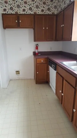 a kitchen with a sink and cabinets