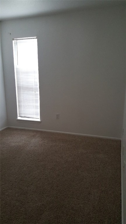 2924 St Joseph Street, Unit B Corpus Christi, TX 78418 - Photo 5 of 11 an empty room with a window