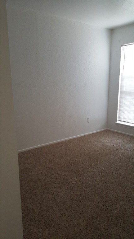 2924 St Joseph Street, Unit B Corpus Christi, TX 78418 - Photo 6 of 11 an empty room with a window