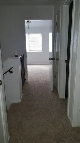 a view of hallway with a window