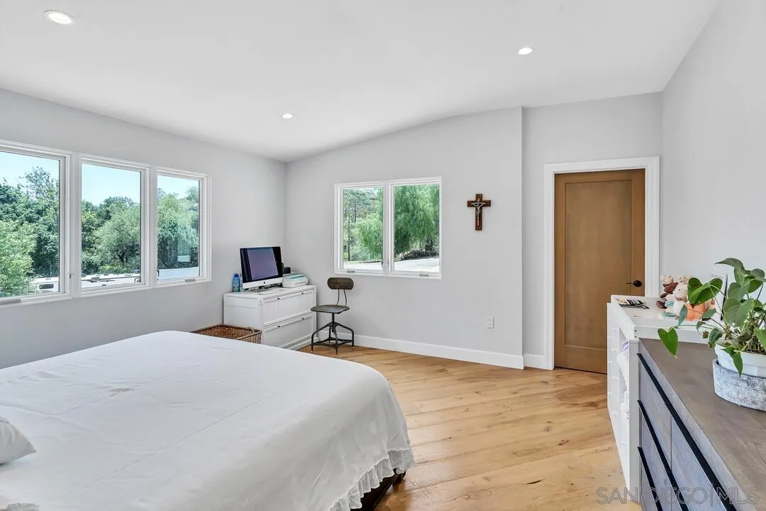 1356 Real Way Lane Alpine, CA 91901 - Photo 19 of 58 a bedroom with a bed and a large window