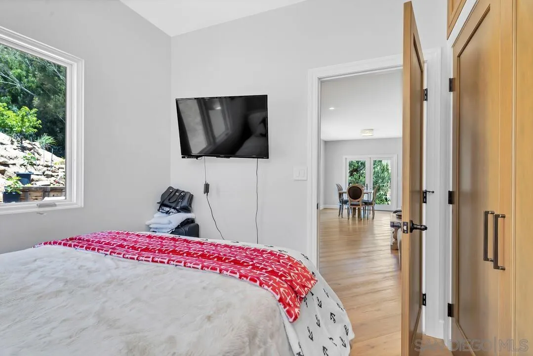 1356 Real Way Lane Alpine, CA 91901 - Photo 24 of 58 a bedroom with a bed and a flat screen tv