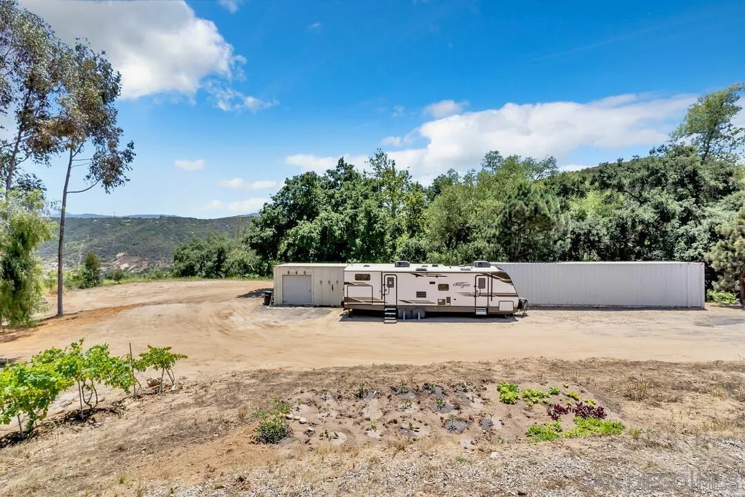 1356 Real Way Lane Alpine, CA 91901 - Photo 26 of 58 a view of a green field with trees in the background