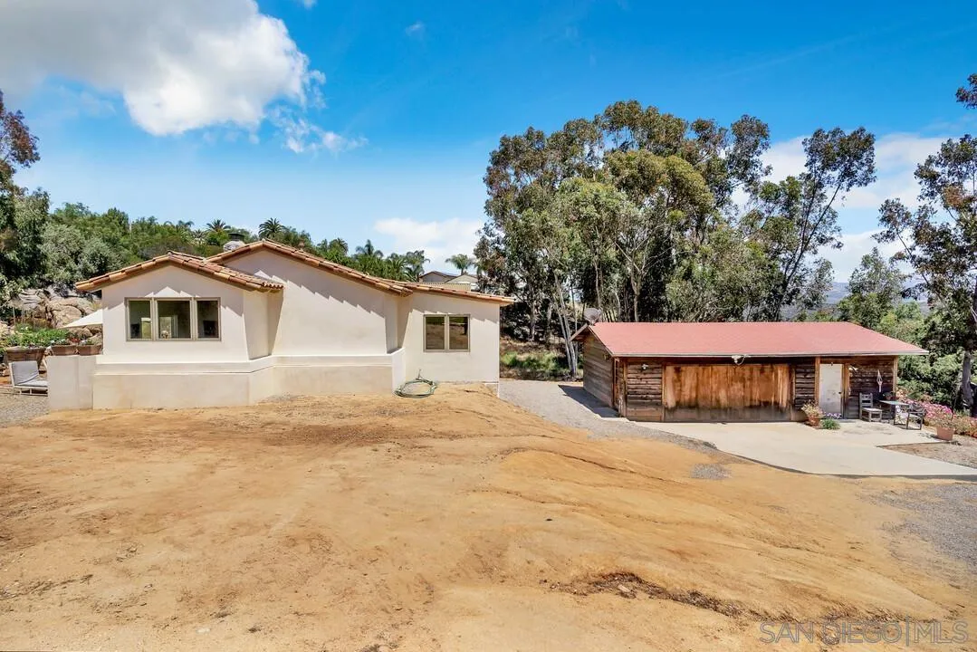 1356 Real Way Lane Alpine, CA 91901 - Photo 32 of 58 a view of a white house with a yard