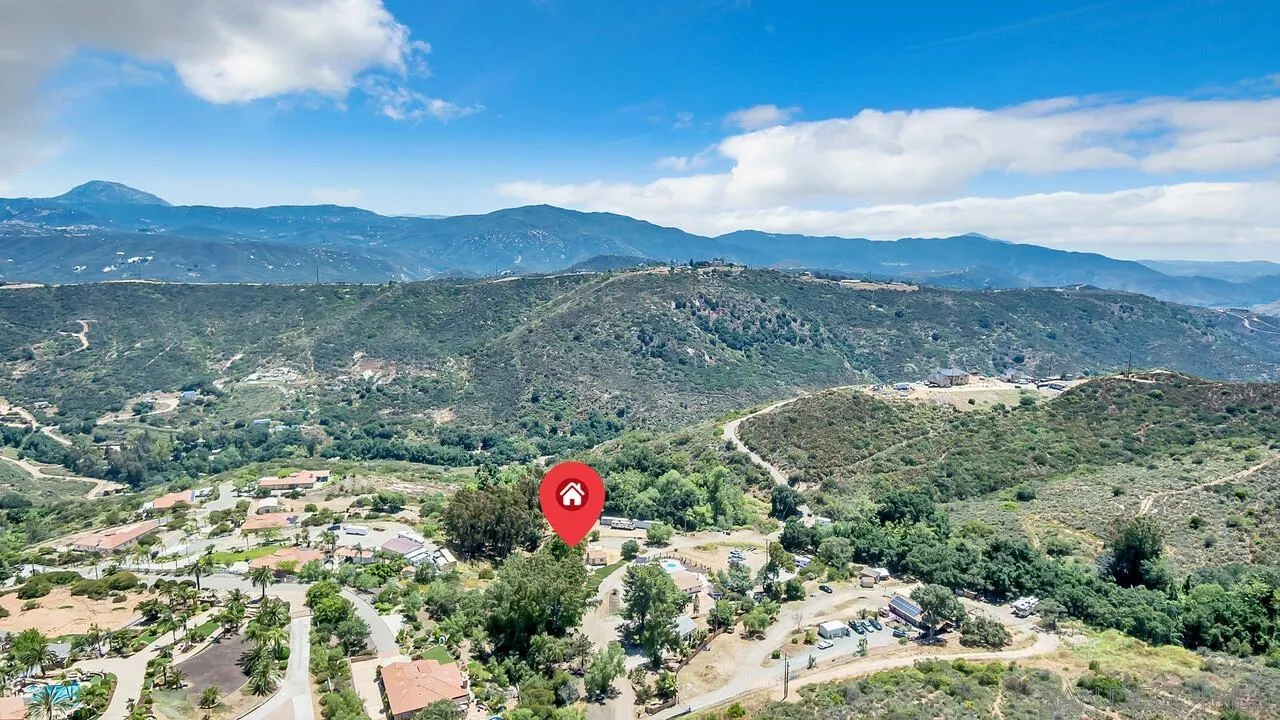 1356 Real Way Lane Alpine, CA 91901 - Photo 46 of 58 a view of a lush green field with mountains in the background