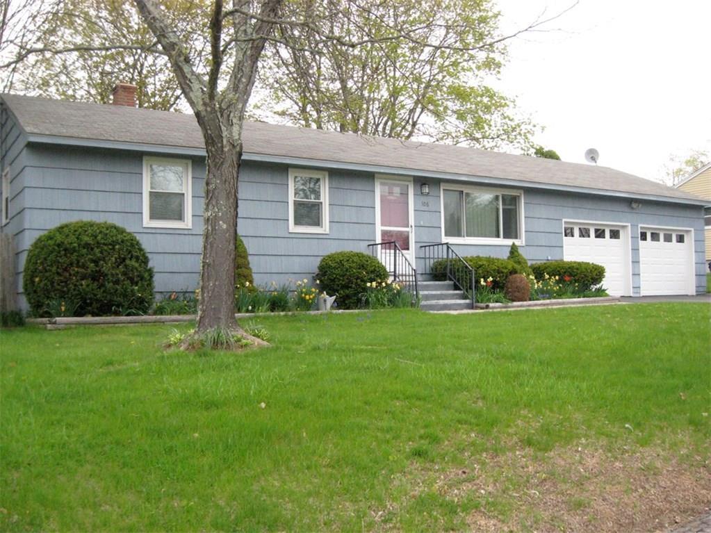 106 Pemberton Road Windham, CT 06226 - Photo 1 of 1 a front view of a house with a garden and yard