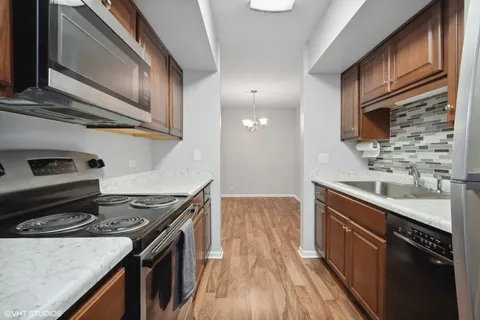 a kitchen with a stove and a sink