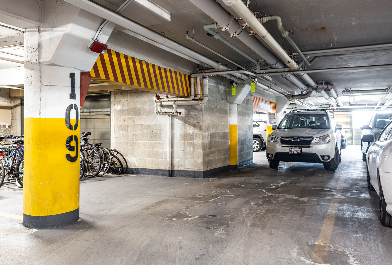 1224 West Van Buren Street, Unit 822 Chicago, IL 60607 - Photo 18 of 21 a view of parking garage with cars