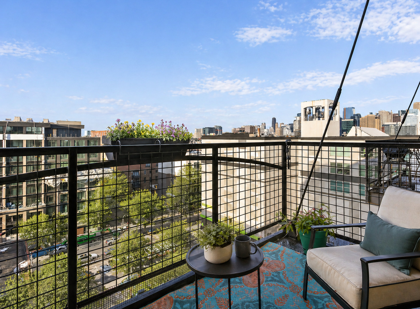 1224 West Van Buren Street, Unit 822 Chicago, IL 60607 - Photo 6 of 21 a balcony with table and chairs