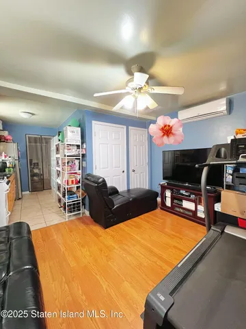 a living room with furniture a dining table and a fireplace