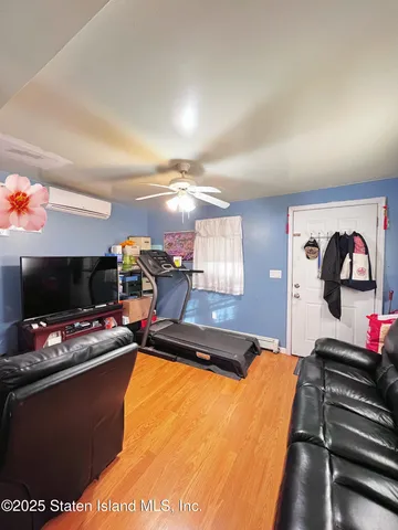 a room with furniture and flat screen tv