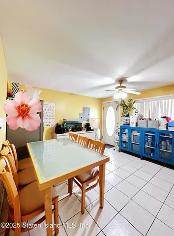 a living room with furniture a chandelier and a table