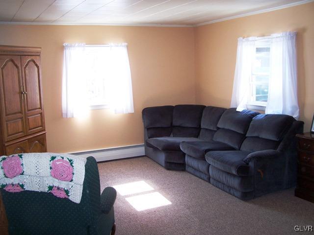 496 Covered Bridge Road, Unit 1 Quakertown, PA 18951 - Photo 5 of 11 a living room with furniture and a window