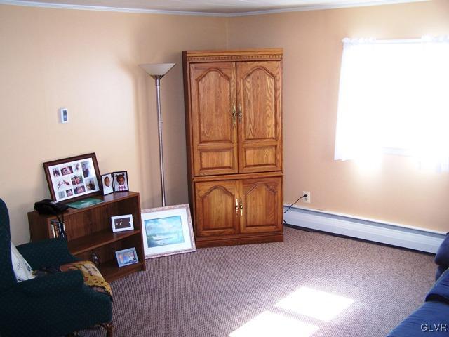 496 Covered Bridge Road, Unit 1 Quakertown, PA 18951 - Photo 6 of 11 a living room with furniture and a window