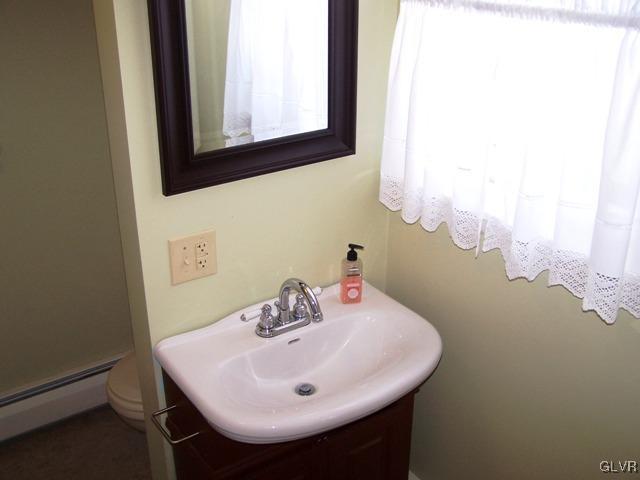 496 Covered Bridge Road, Unit 1 Quakertown, PA 18951 - Photo 10 of 11 a bathroom with a sink and a mirror