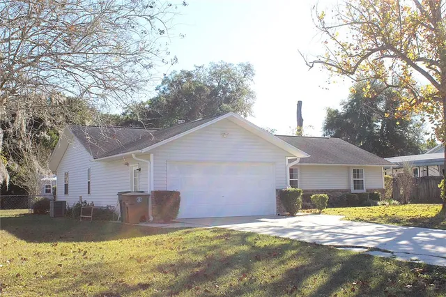 a view of a yard in front of a house with a yard