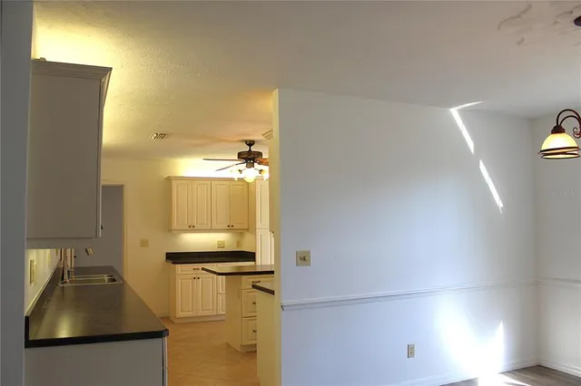 a close view of a sink and a vanity in the bathroom