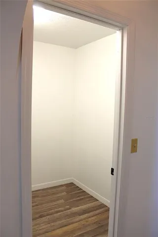 a bathroom with a granite countertop toilet a sink and a shower