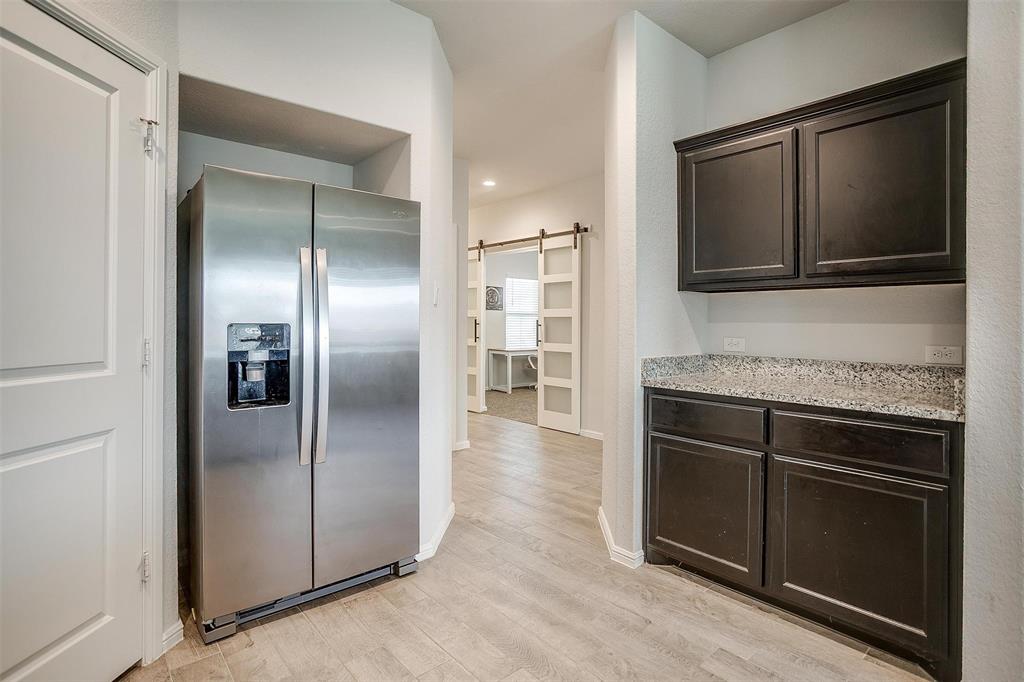 9721 Cherryville Road Fort Worth, TX 76108 - Photo 6 of 23 Yes, the refrigerator stays.