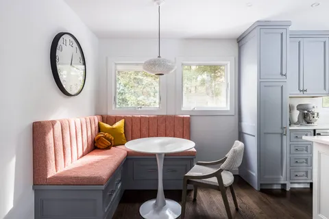 a living room with furniture a window and a chair