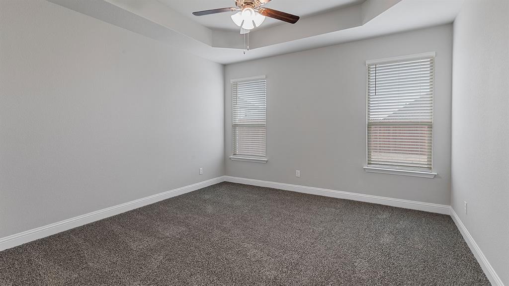 11312 Treehouse Trail Justin, TX 76247 - Photo 11 of 31 a view of an empty room with a window