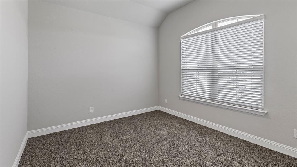 11312 Treehouse Trail Justin, TX 76247 - Photo 17 of 31 an empty room with a window