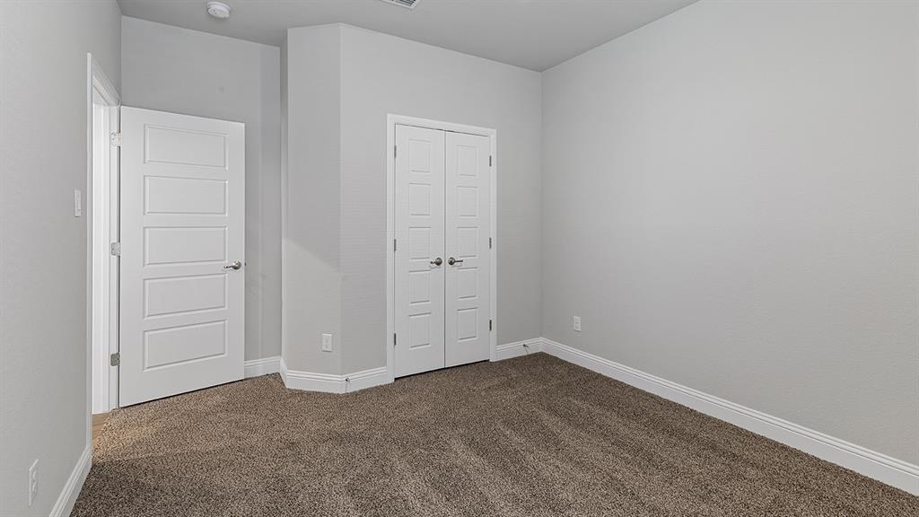 11312 Treehouse Trail Justin, TX 76247 - Photo 21 of 31 an empty room with closet area