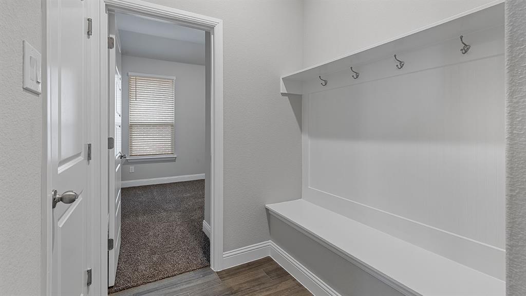 11312 Treehouse Trail Justin, TX 76247 - Photo 22 of 31 a bathroom with a bathtub