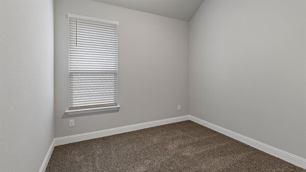 11312 Treehouse Trail Justin, TX 76247 - Photo 23 of 31 an empty room with a window