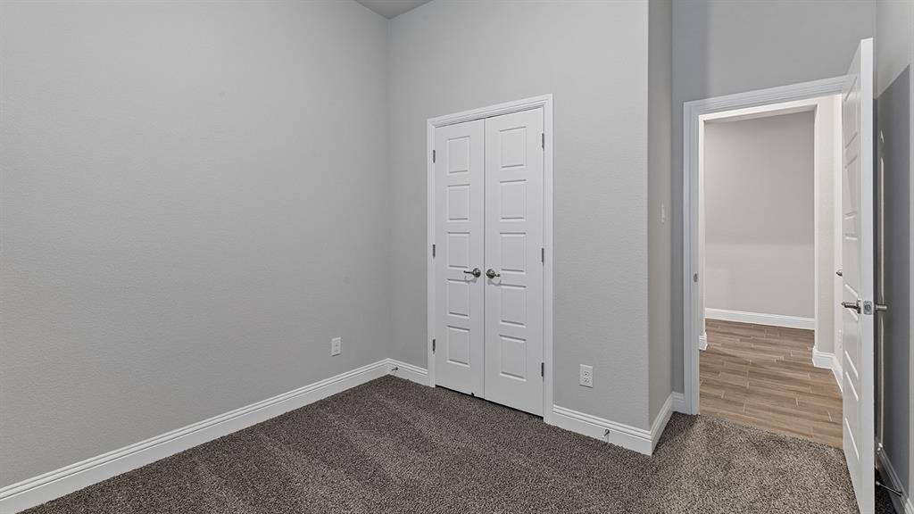 11312 Treehouse Trail Justin, TX 76247 - Photo 24 of 31 an empty room with closet area