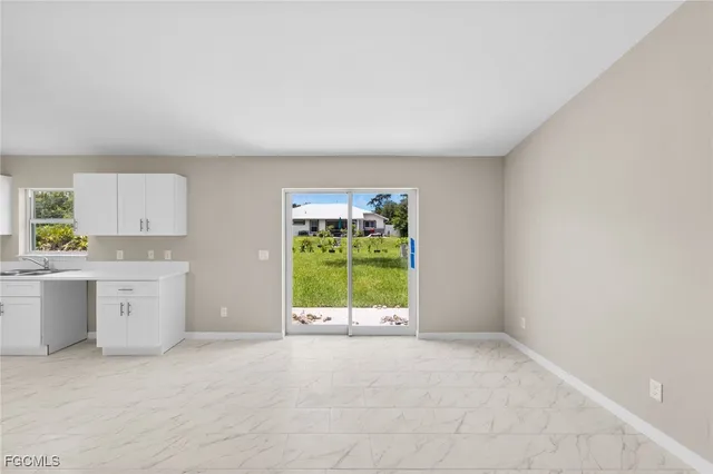a view of a kitchen with a sink and a window
