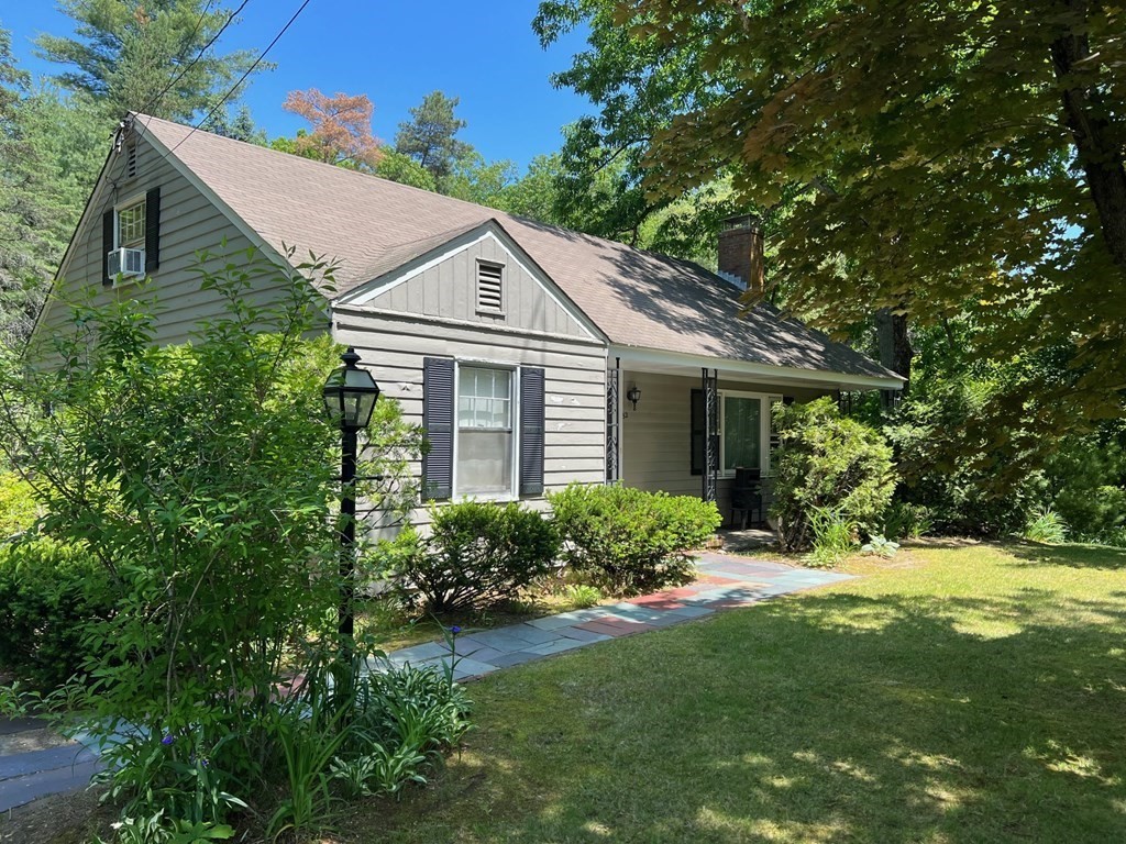 52 Laws Brook Road Acton, MA 01720 - Photo 2 of 5 front view of a house with a yard