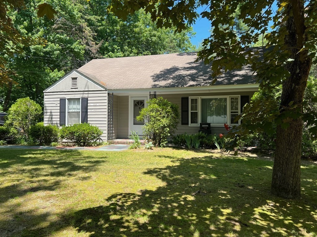 52 Laws Brook Road Acton, MA 01720 - Photo 3 of 5 a house that has a tree in front of it
