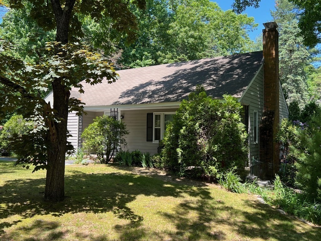 52 Laws Brook Road Acton, MA 01720 - Photo 4 of 5 a view of a house with a tree in the yard