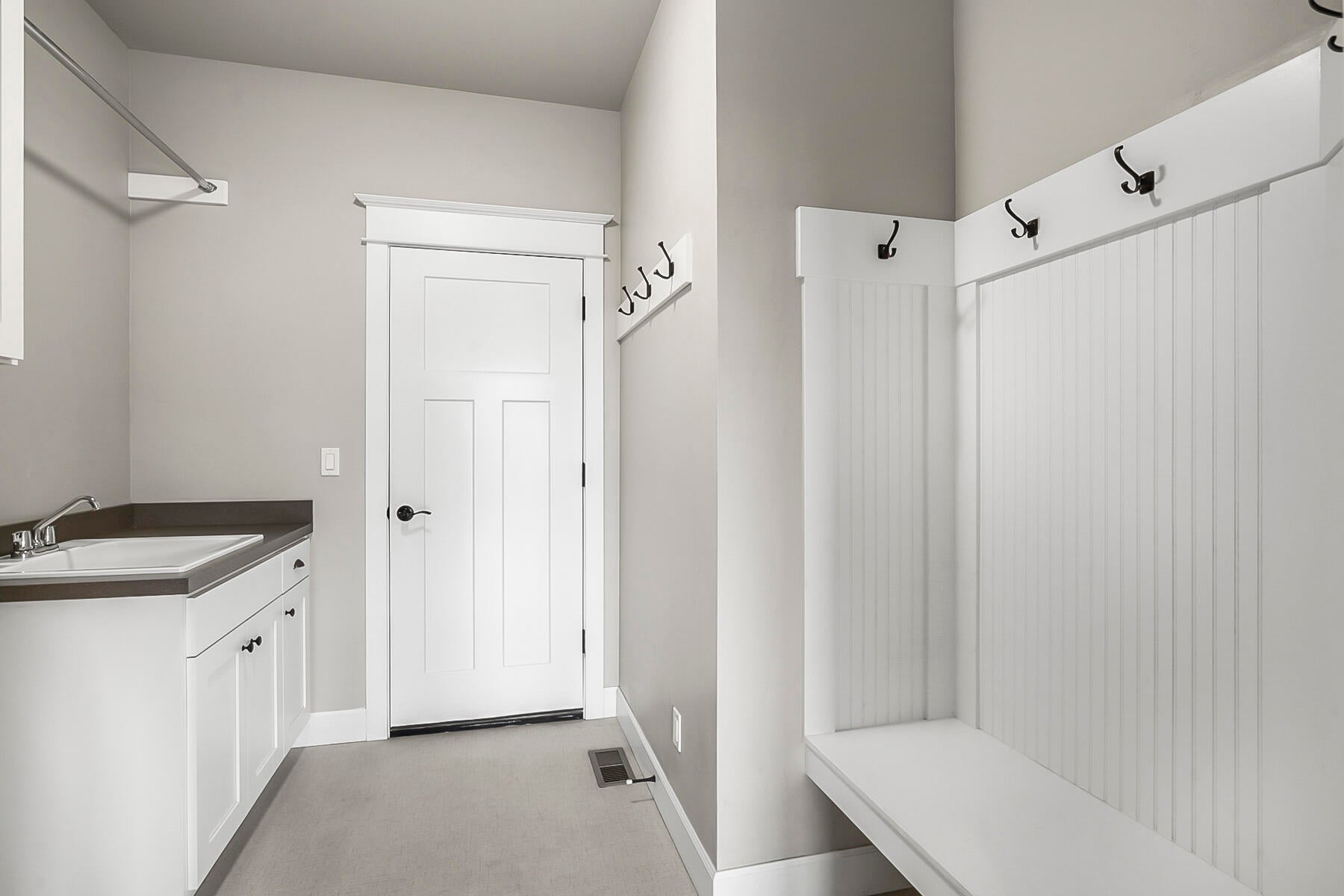 2612 Northwest Compass Corner Loop Bend, OR 97703 - Photo 26 of 44 Laundry Room and Garage entry with Coat rack and seating. Laundry Sink and Hanging rack as well...