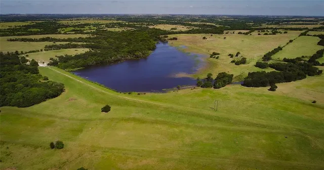 a view of a lake with a yard