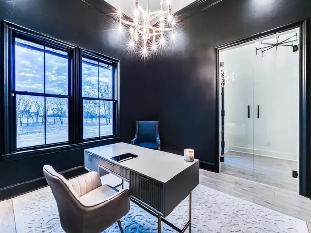 a bedroom with a bed couch and dresser