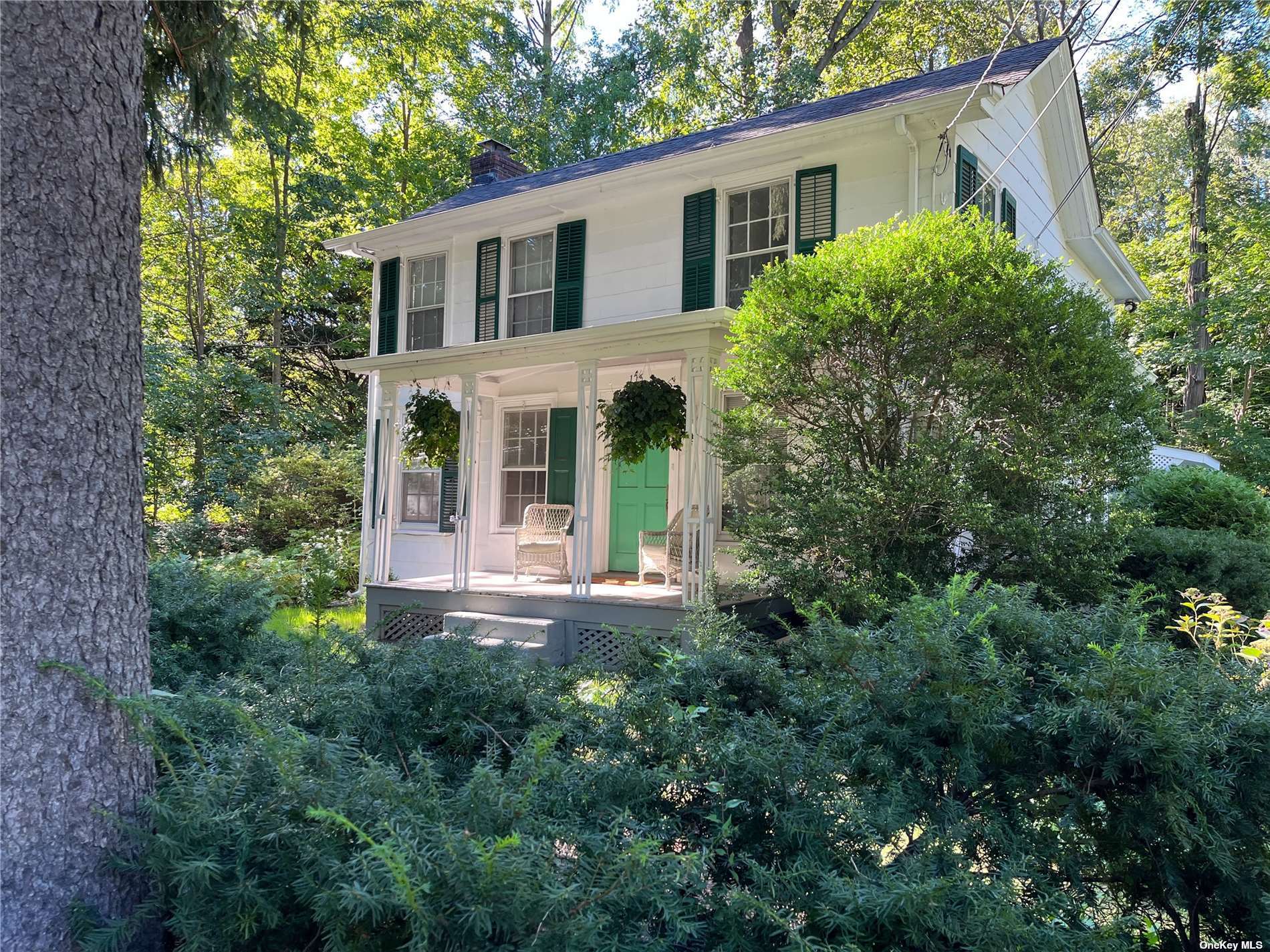 175 Buckram Road Locust Valley, NY 11560 - Photo 1 of 1 a view of a house with balcony and garden