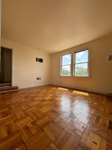 a view of an empty room and window
