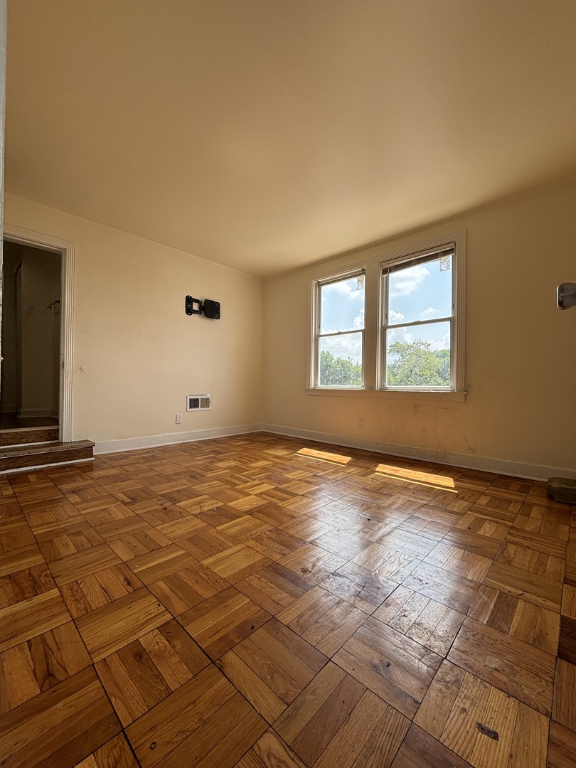 2530 North Neva Avenue Chicago, IL 60707 - Photo 19 of 50 a view of an empty room and window