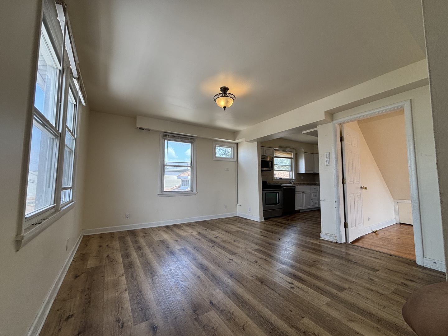 2530 North Neva Avenue Chicago, IL 60707 - Photo 23 of 50 wooden floor in an empty room with a window