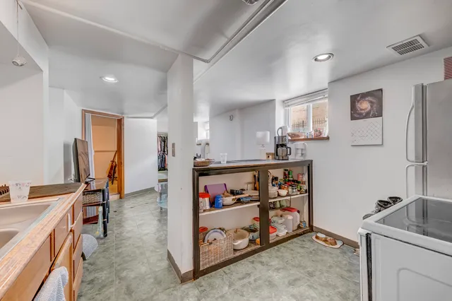 a kitchen with stainless steel appliances granite countertop a sink and cabinets