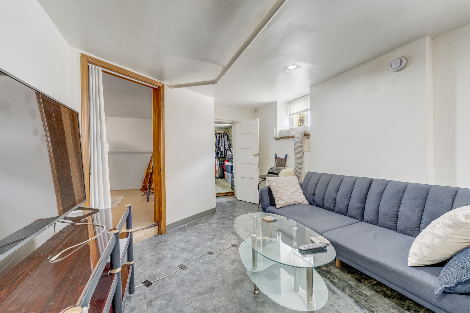 2530 North Neva Avenue Chicago, IL 60707 - Photo 29 of 50 a living room with furniture and a flat screen tv