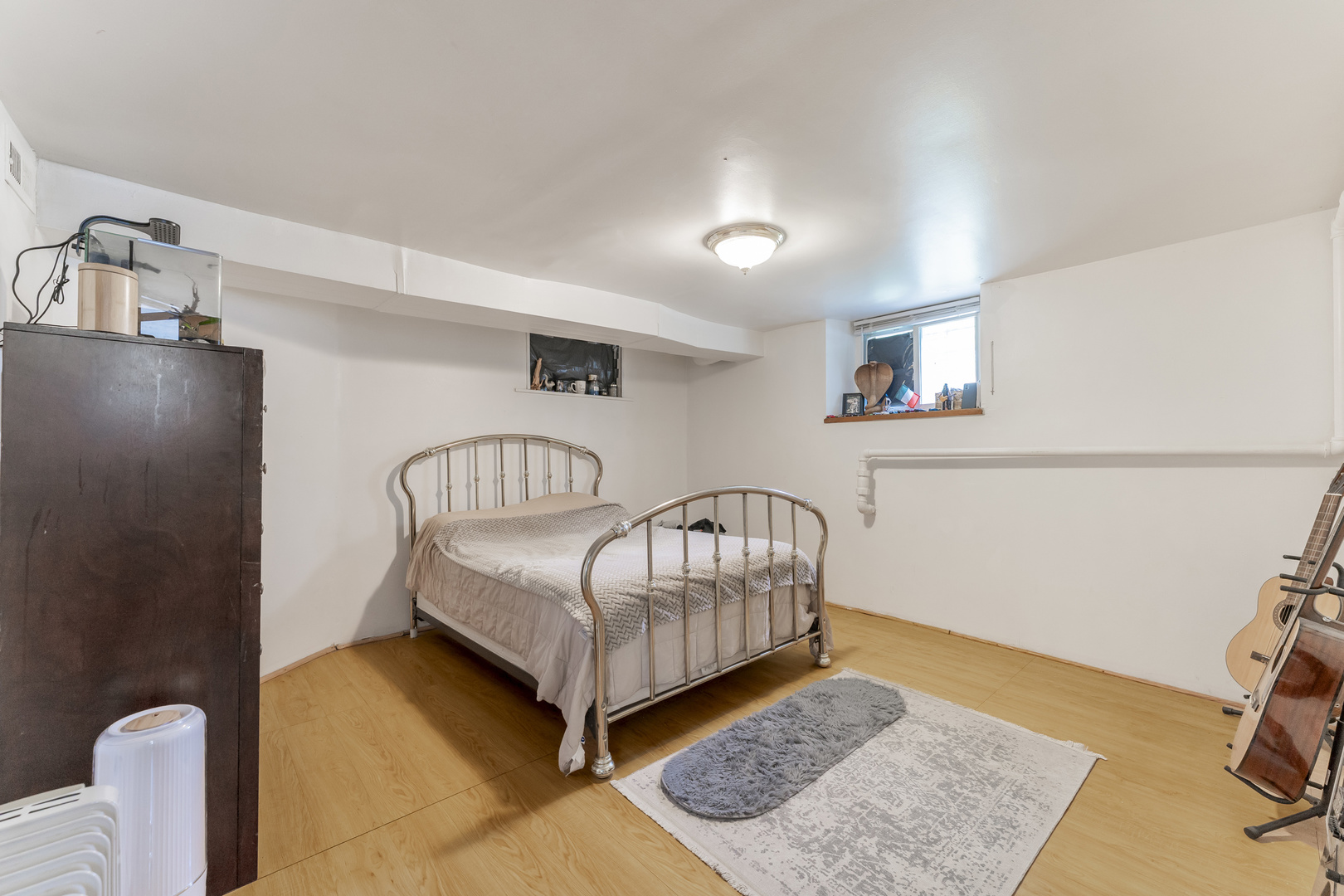 2530 North Neva Avenue Chicago, IL 60707 - Photo 30 of 50 a bedroom with a bed and wooden floor