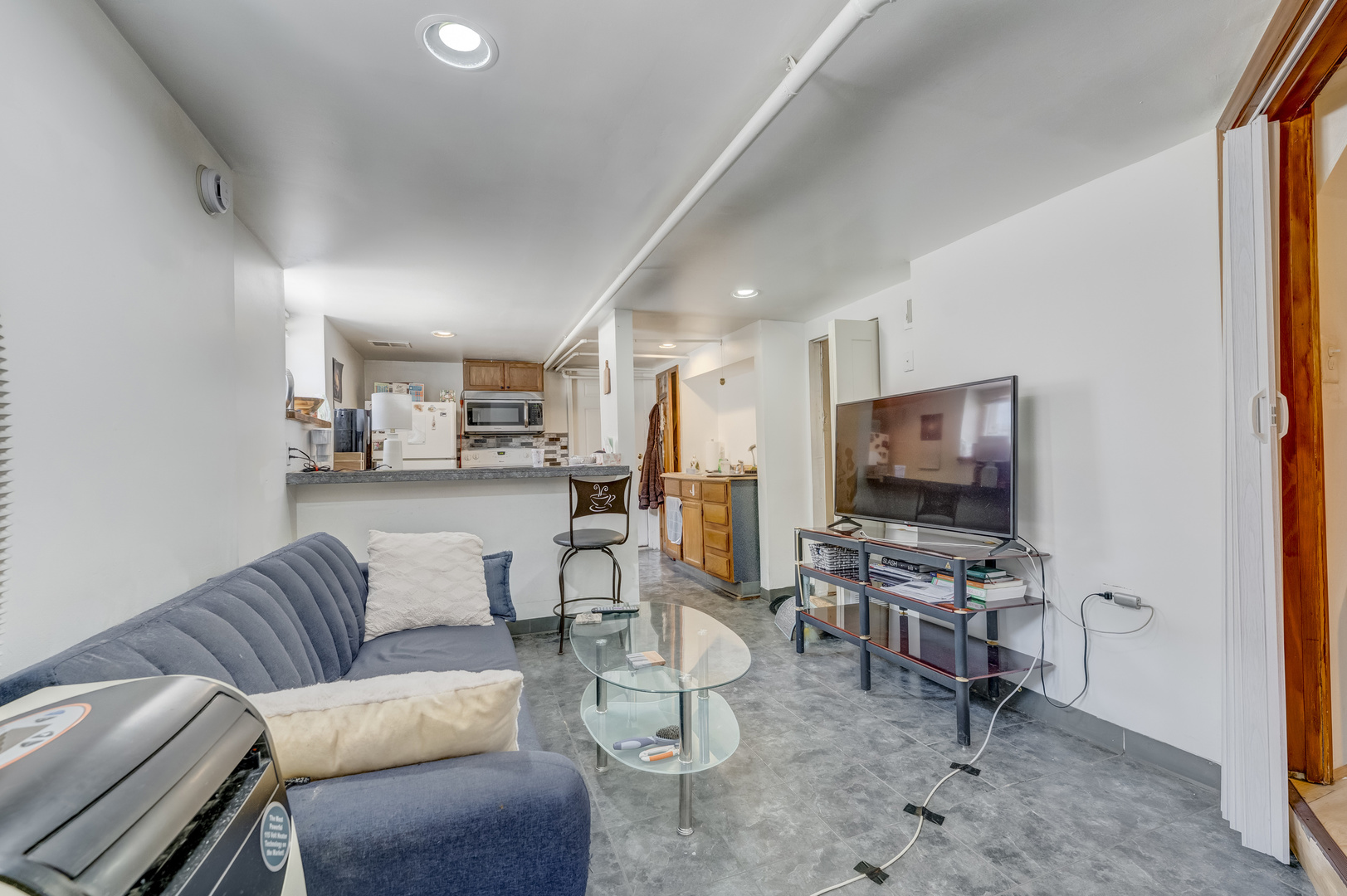 2530 North Neva Avenue Chicago, IL 60707 - Photo 31 of 50 a living room with furniture and a flat screen tv